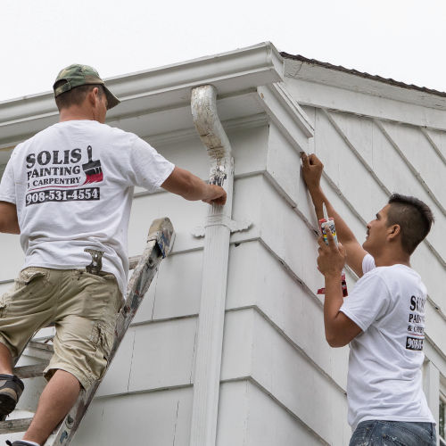 Solis estimator preparing an on-site house painting estimate in New Jersey